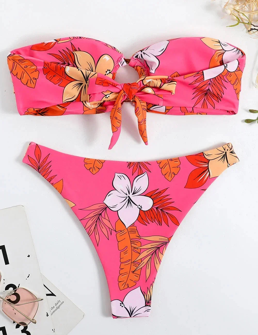 Women's pink bandeau bikini with floral pattern and ring detail