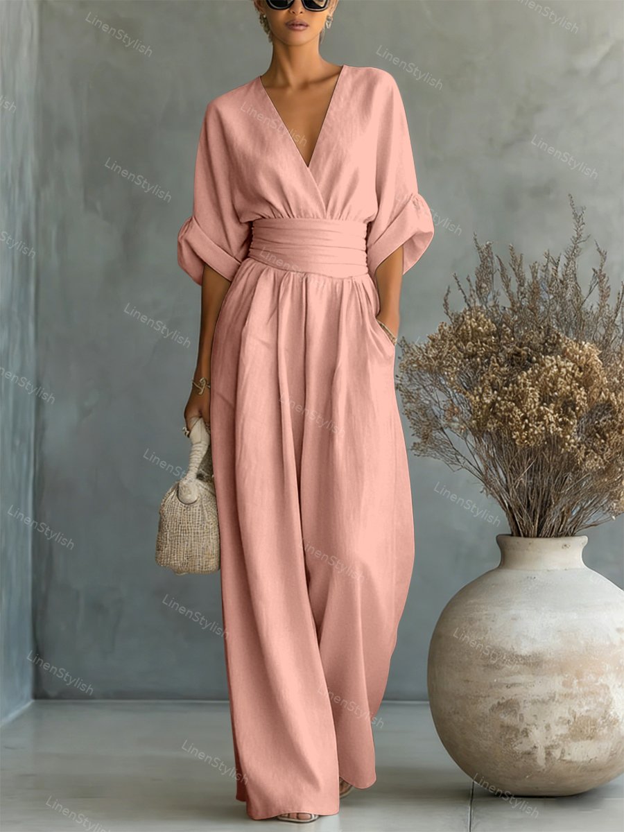 Combinaison femme avec décolleté plongeant en V, ceinture et jambes larges