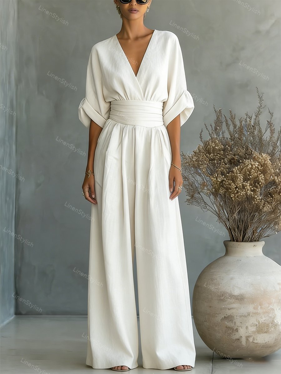Combinaison femme avec décolleté plongeant en V, ceinture et jambes larges