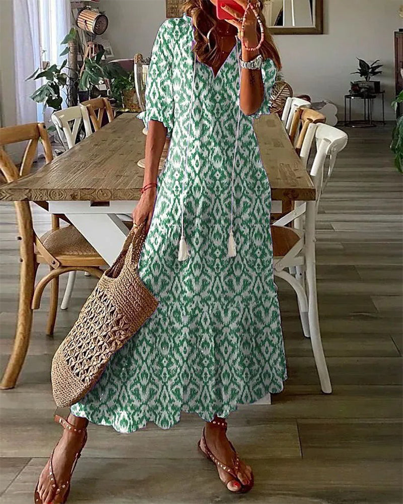 Long bohemian dress with V-neck and flowing drape
