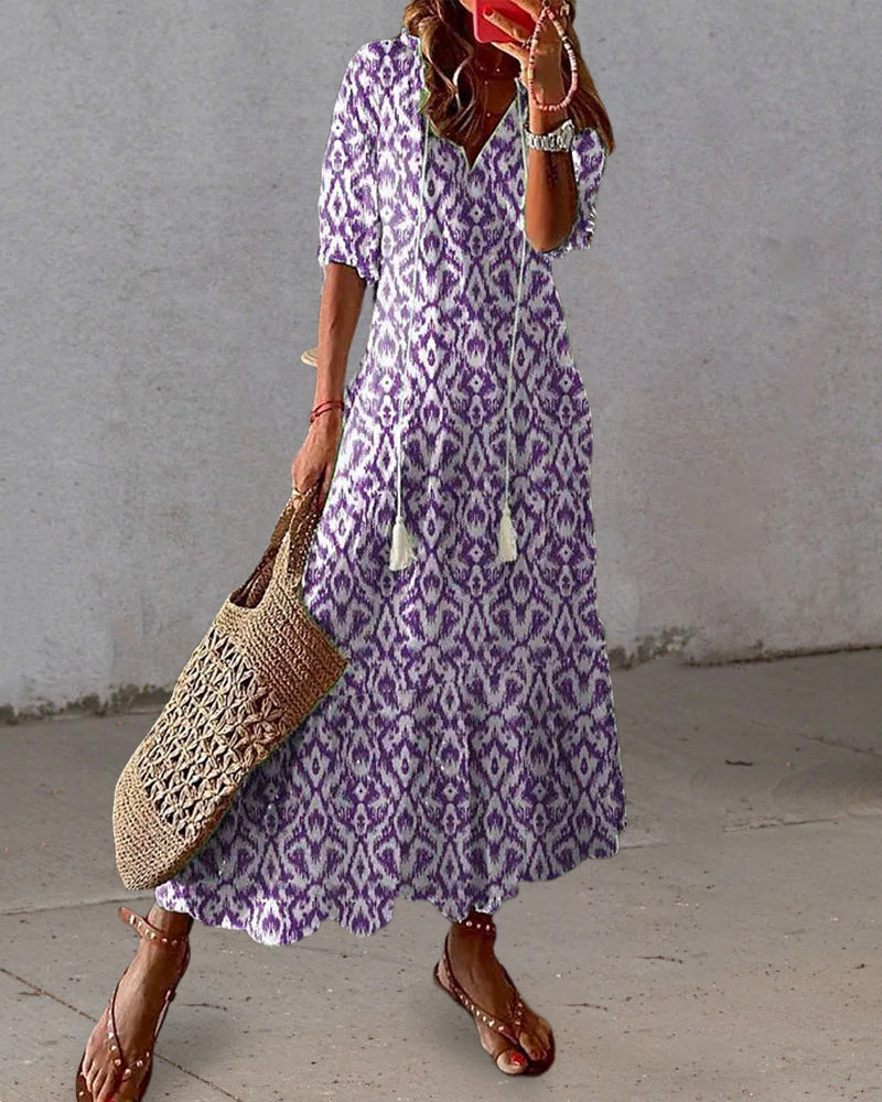 Long bohemian dress with V-neck and flowing drape
