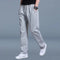Pánské tepláky na jogging na všechny roční období se stahováním v pase a kapsami
