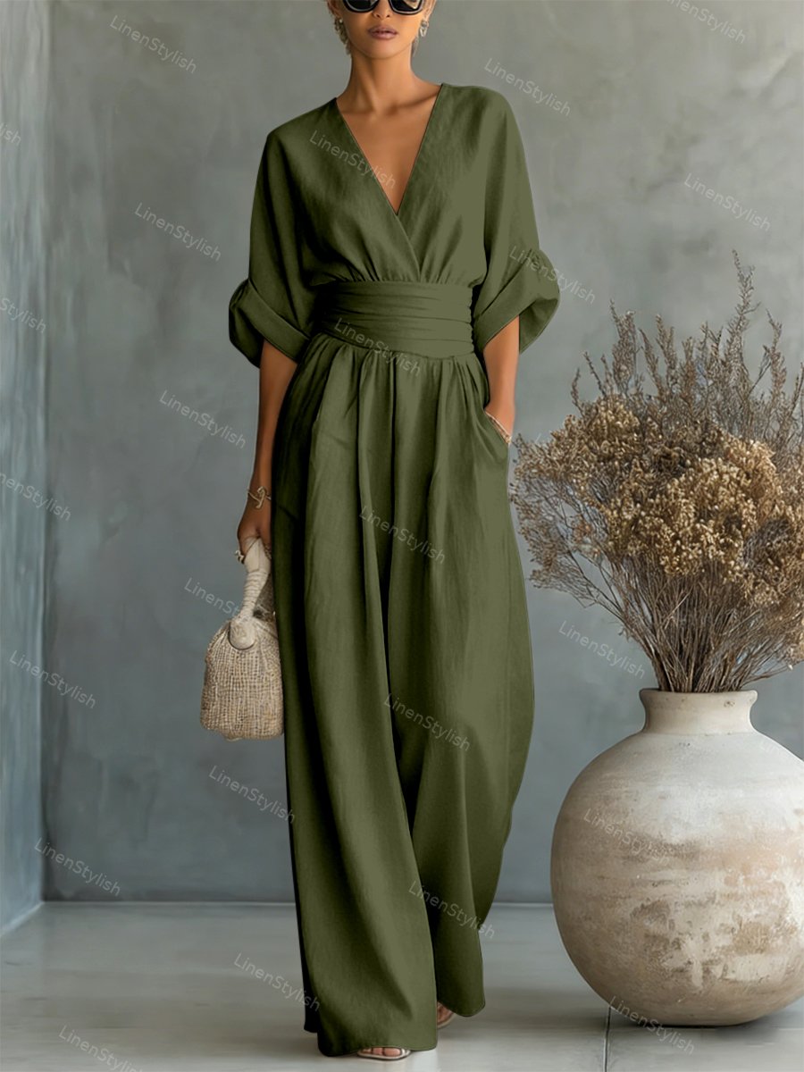 Combinaison femme avec décolleté plongeant en V, ceinture et jambes larges